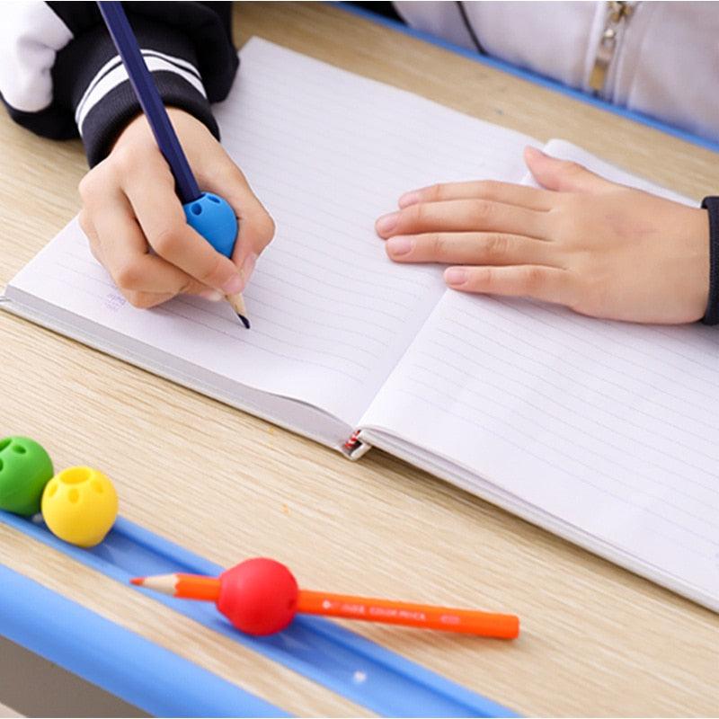 Set of 1-3 silicone ball pen grips by Stevvex for kids and adults, ergonomic writing aid for right and left-handed users.