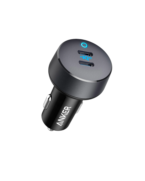 Anker PowerDrive III Duo USB-C car charger plugged into a vehicle's cigarette lighter socket, with two USB-C ports visible.