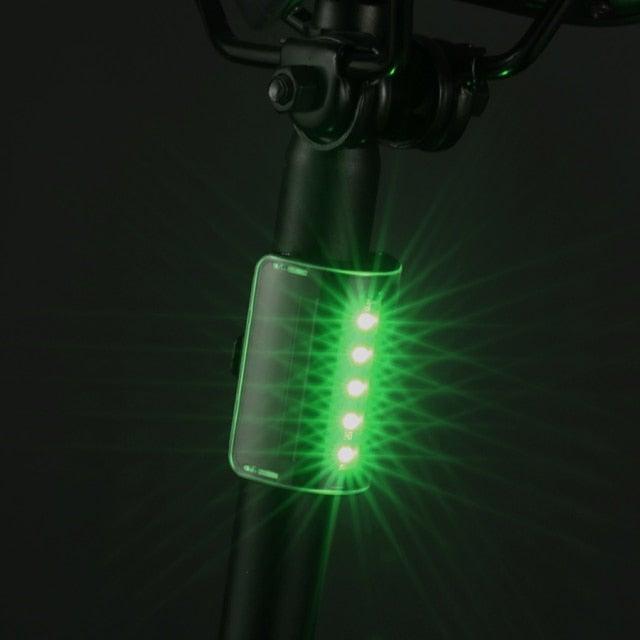 Stevvex auto-sensing waterproof bicycle taillight and headlight with LED modes, USB rechargeable, for night riding safety.