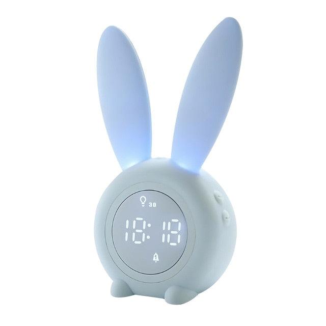 Cute bunny ear LED digital alarm clock by Stevvex with night light, touch control, snooze, USB sound control, and playful design for kids.