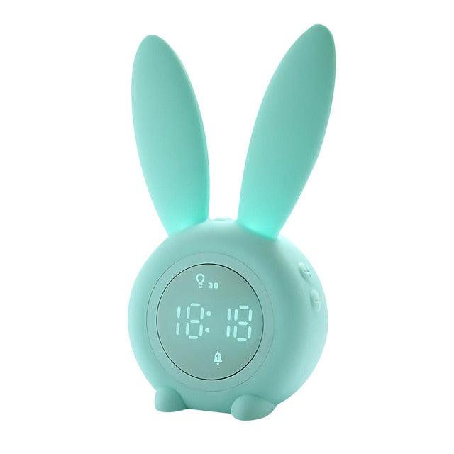 Cute bunny ear LED digital alarm clock for kids, with night light, touch control, snooze, and USB sound control in a playful design.