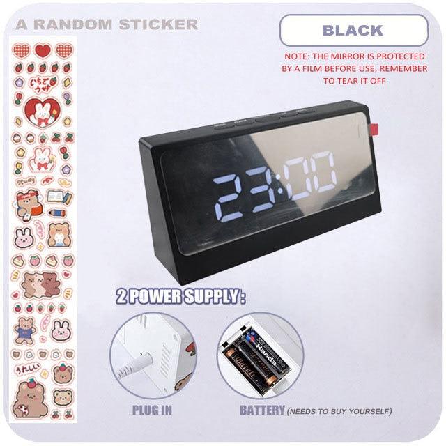 Stevvex digital table clock with LED display, snooze alarm, mirror surface, USB charger, and adjustable brightness for bedroom or desk.