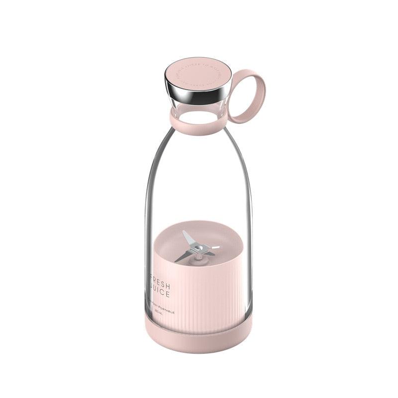 Stevvex portable electric USB mini fruit blender with compact design, showing a clear view of the small blender and fresh fruits inside.