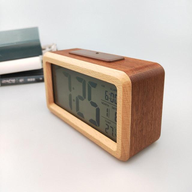 Wooden digital alarm clock with LED display, wireless charging, multiple alarms, sound control, and snooze, ideal for bedroom or office.