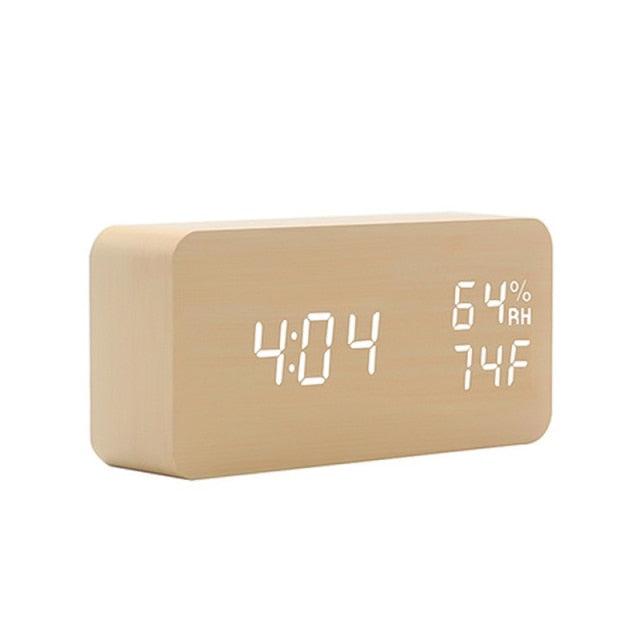 Stevvex USB/AAA powered LED wooden digital alarm clock with wireless charging, dual alarms, sound control, and snooze feature.
