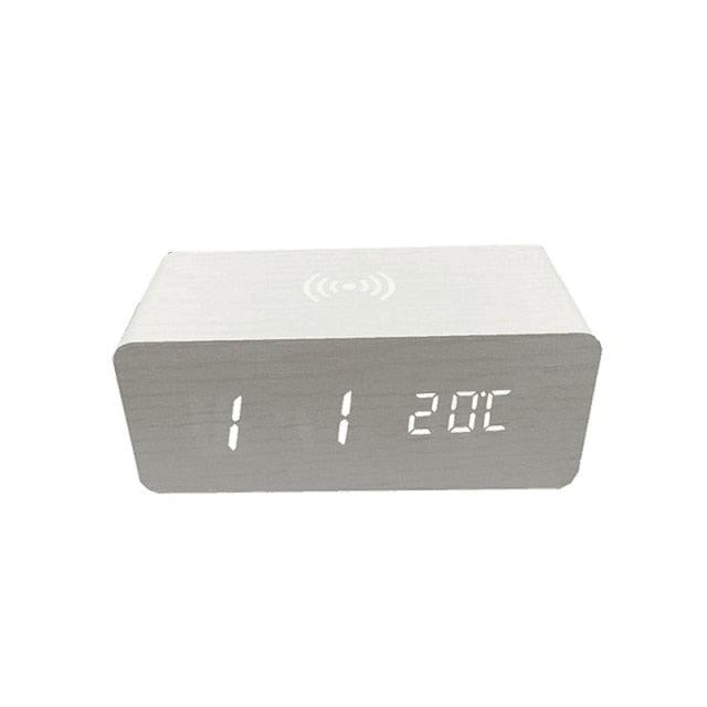 Stevvex wooden digital alarm clock with LED display, wireless charging, three alarms, sound control, snooze, and voice activation.