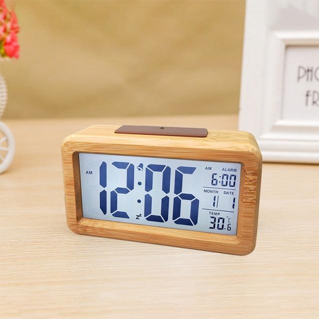 Stevvex USB/AAA powered wooden digital alarm clock with LED display, wireless charging, multiple alarms, and sound control.